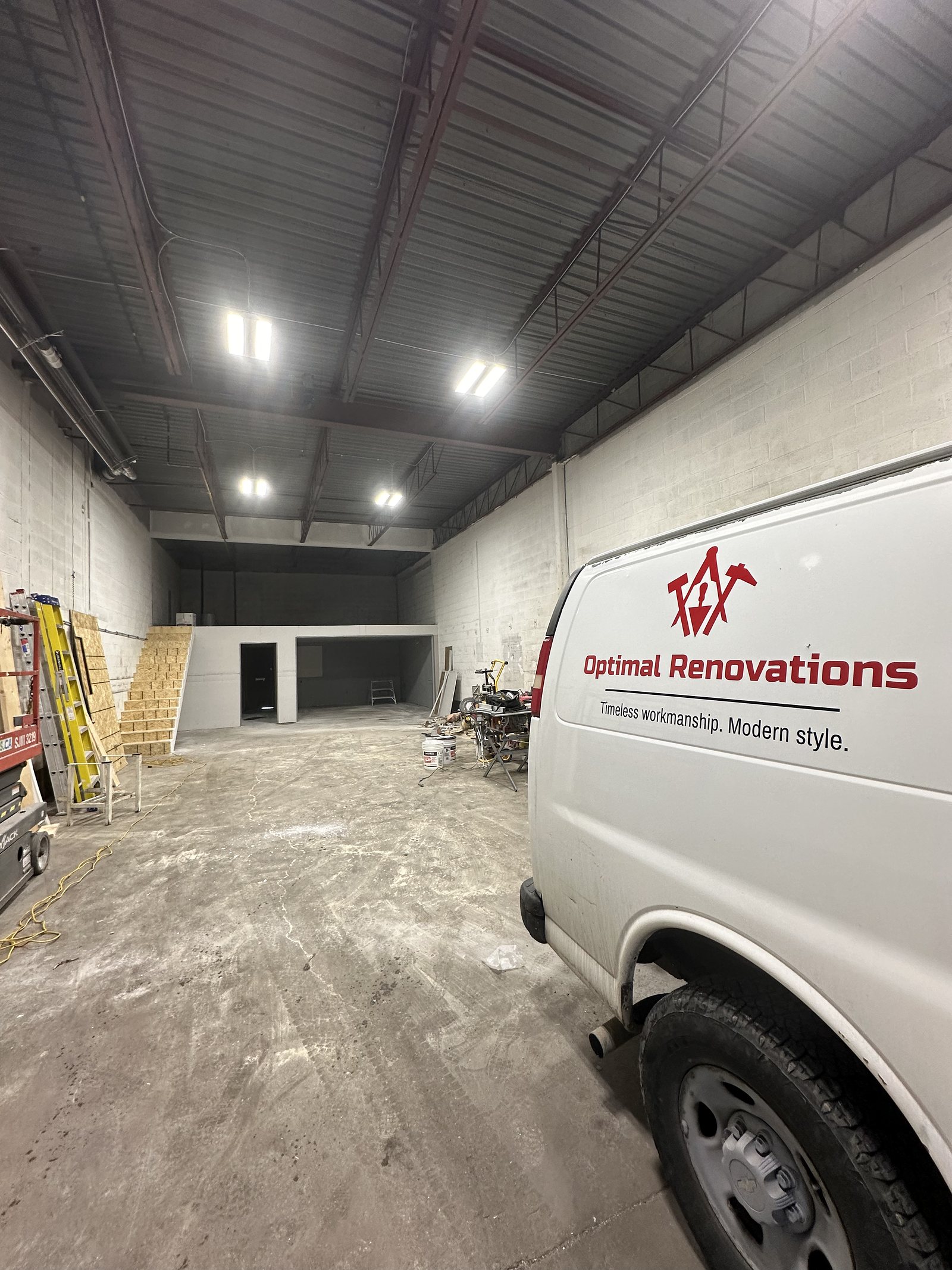 Optimal Renovations van inside the commercial unit during the fit-out, before finishes