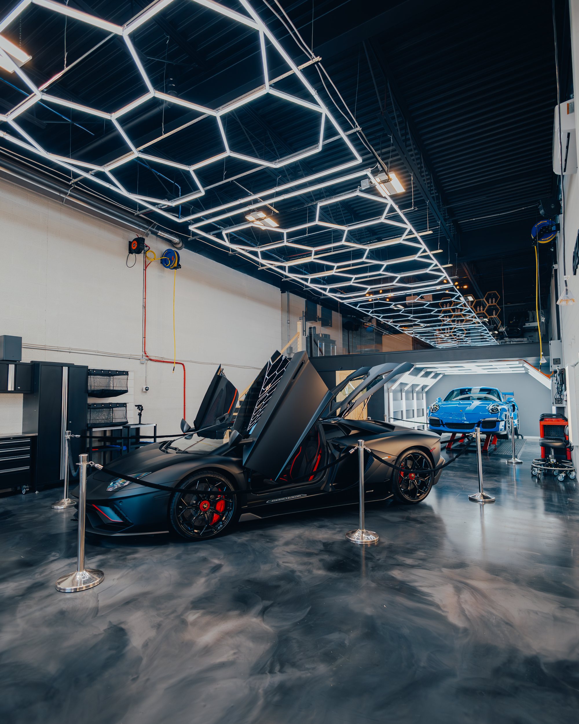 Commercial workshop with a hexagon LED ceiling grid and polished concrete floor