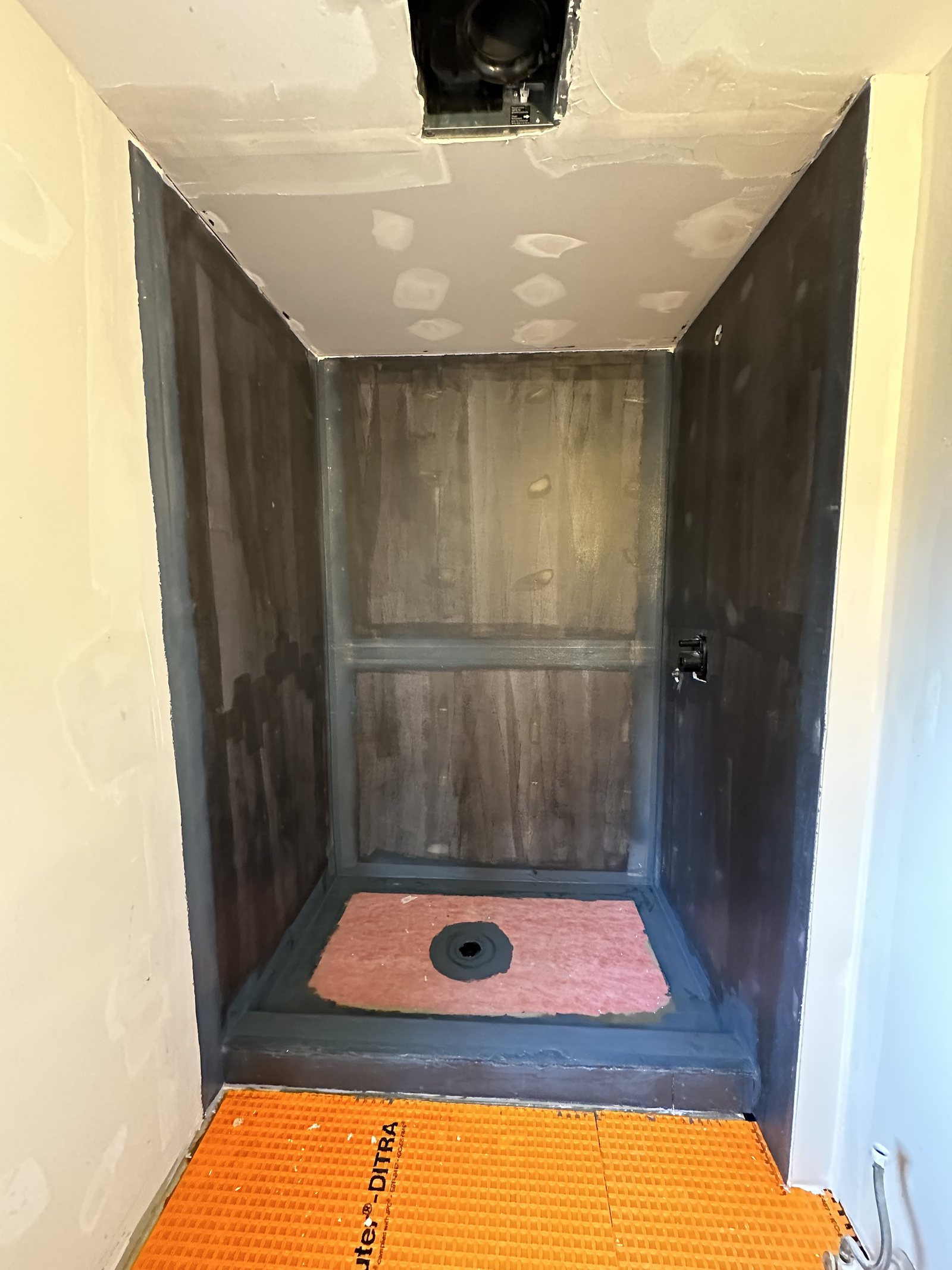 Shower waterproofing membrane and tile underlay during a bathroom renovation
